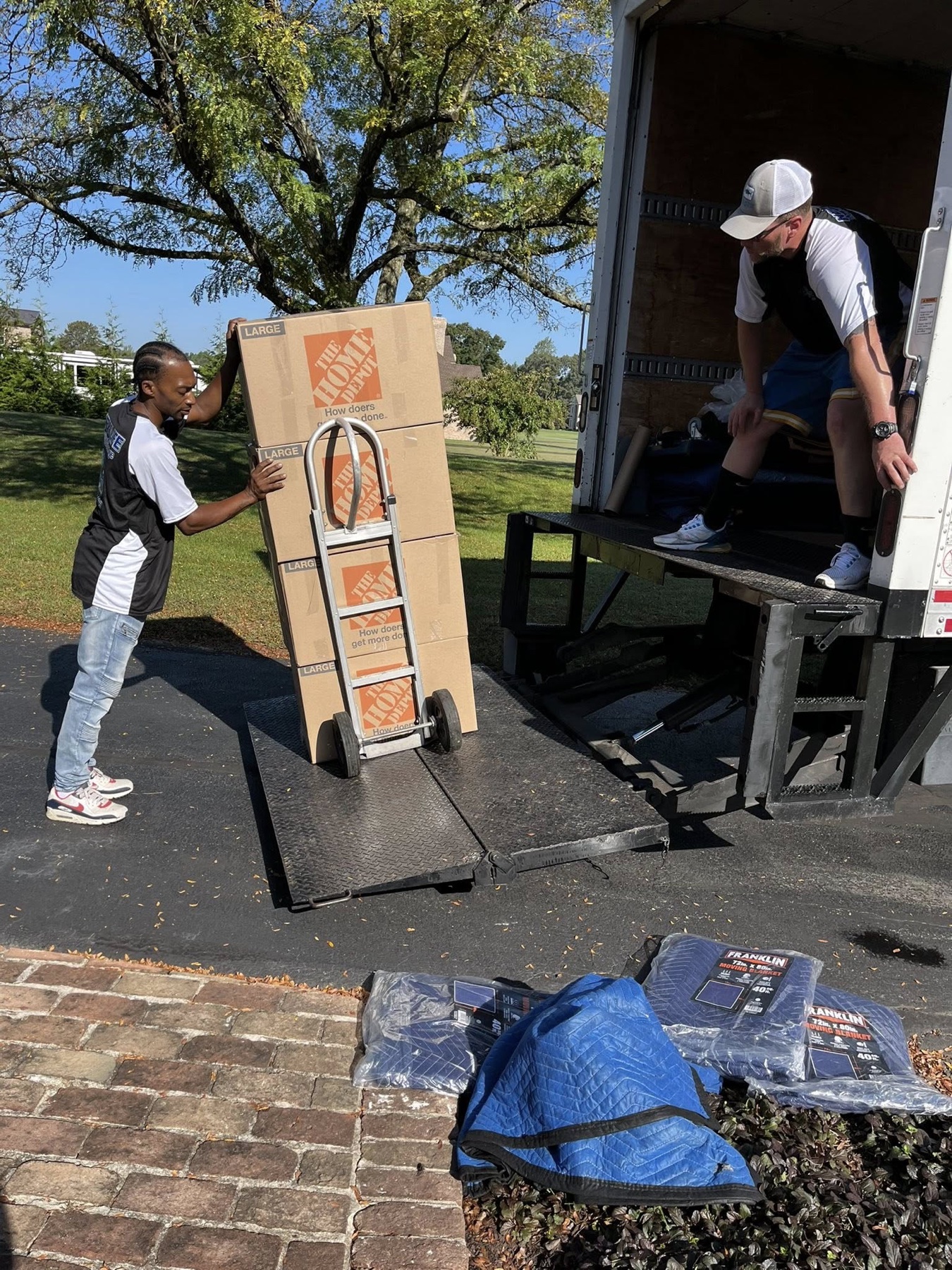 Roger That crew loading a protected item into a moving truck